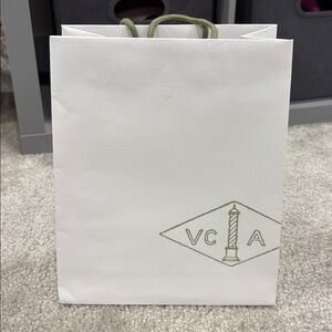 Van Cleef & Arpels White Bag with Green Text